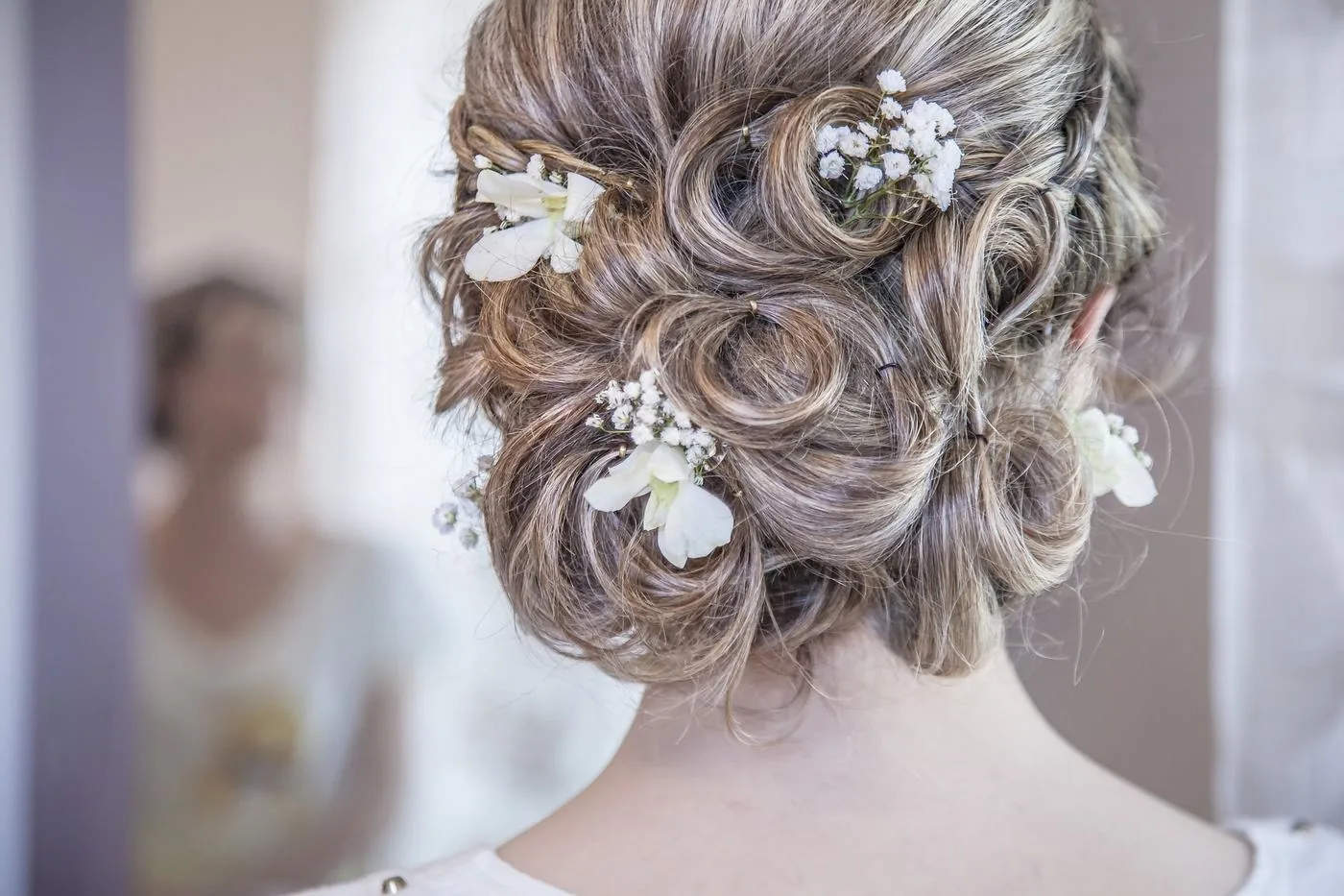 Bridal updo with white flowers